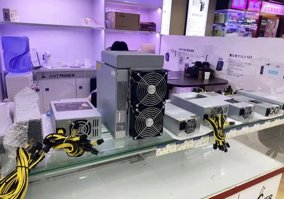 Image showcasing a large-scale mining farm with rows of ASIC miners.